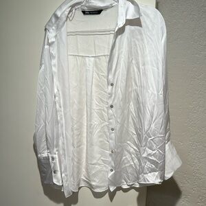 White silky button down shirt.